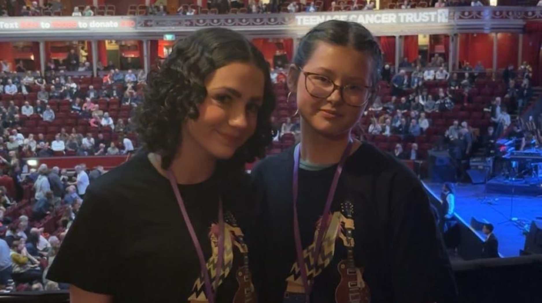 Keira and another of our Young Ambassadors, Sophie, smiling together at The Royal Albert Hall in London