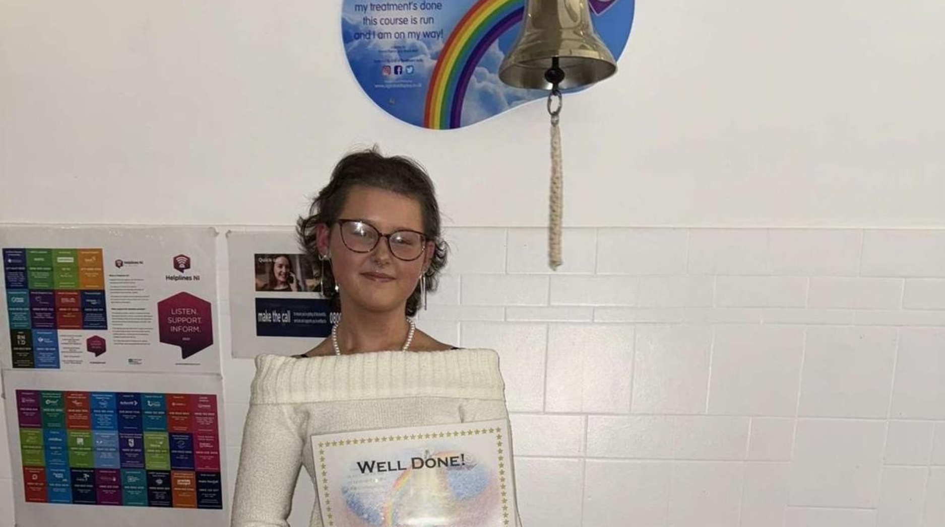 Keira smiling after ringing the bell in the Royal Belfast Hospital for Sick Children to mark the end of her treatment