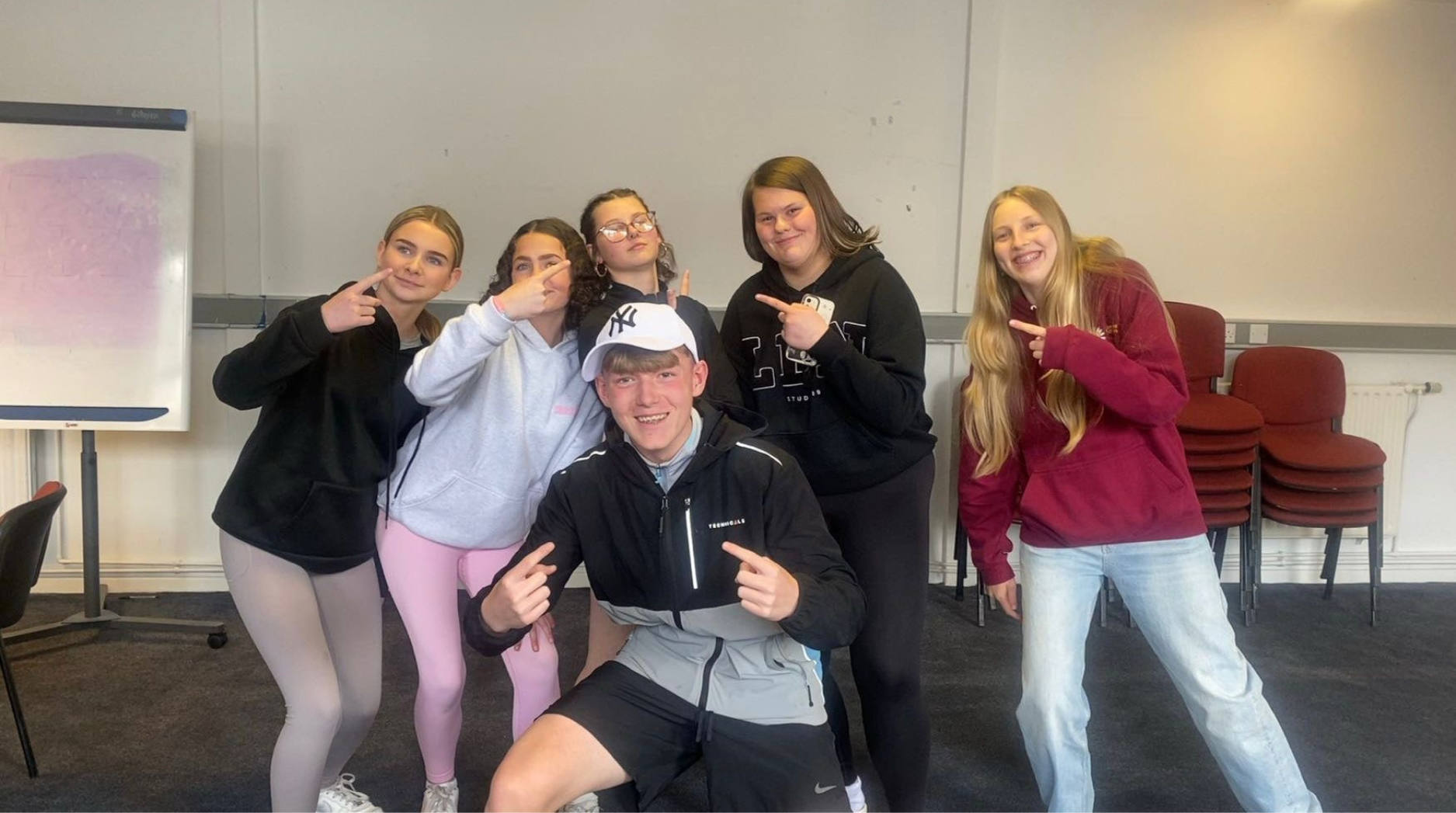 Keira and her friends from the Youth Engagement Group smiling together for a group photo.